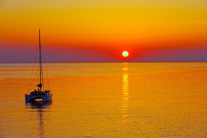 Santorini Sunset Luxury Sailing Catamaran Cruise with BBQ, drinks, transfer - White Beach, lunch, and the best stretch of swimming