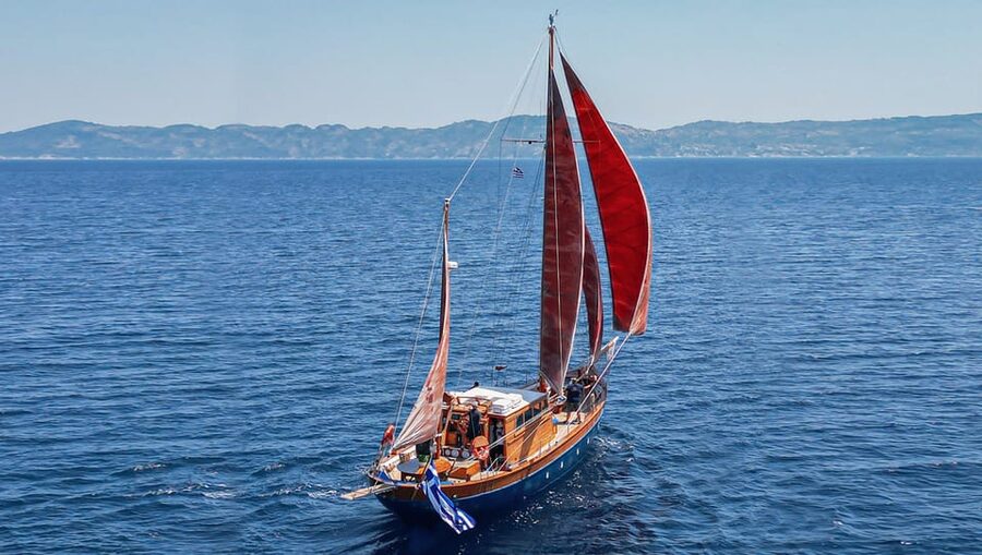 Skiathos: Wooden Sailboat Full- or Half-Day Trip with Meal - Kastani Beach: a swim stop with a film connection