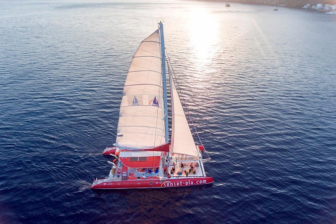 Sunset Sailing Catamaran Cruise in Santorini with BBQ and Drinks - Red Beach from offshore