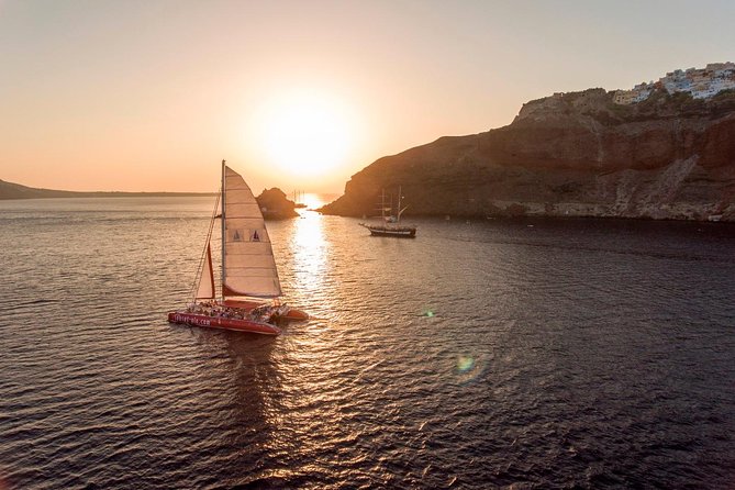 Sunset Sailing Catamaran Cruise in Santorini with BBQ and Drinks - Boarding the catamaran and setting the tone