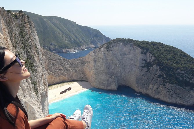 Zakynthos : One day small group tour to Navagio beach Blue Caves & top view - Navagio Beach from the water and the cliff